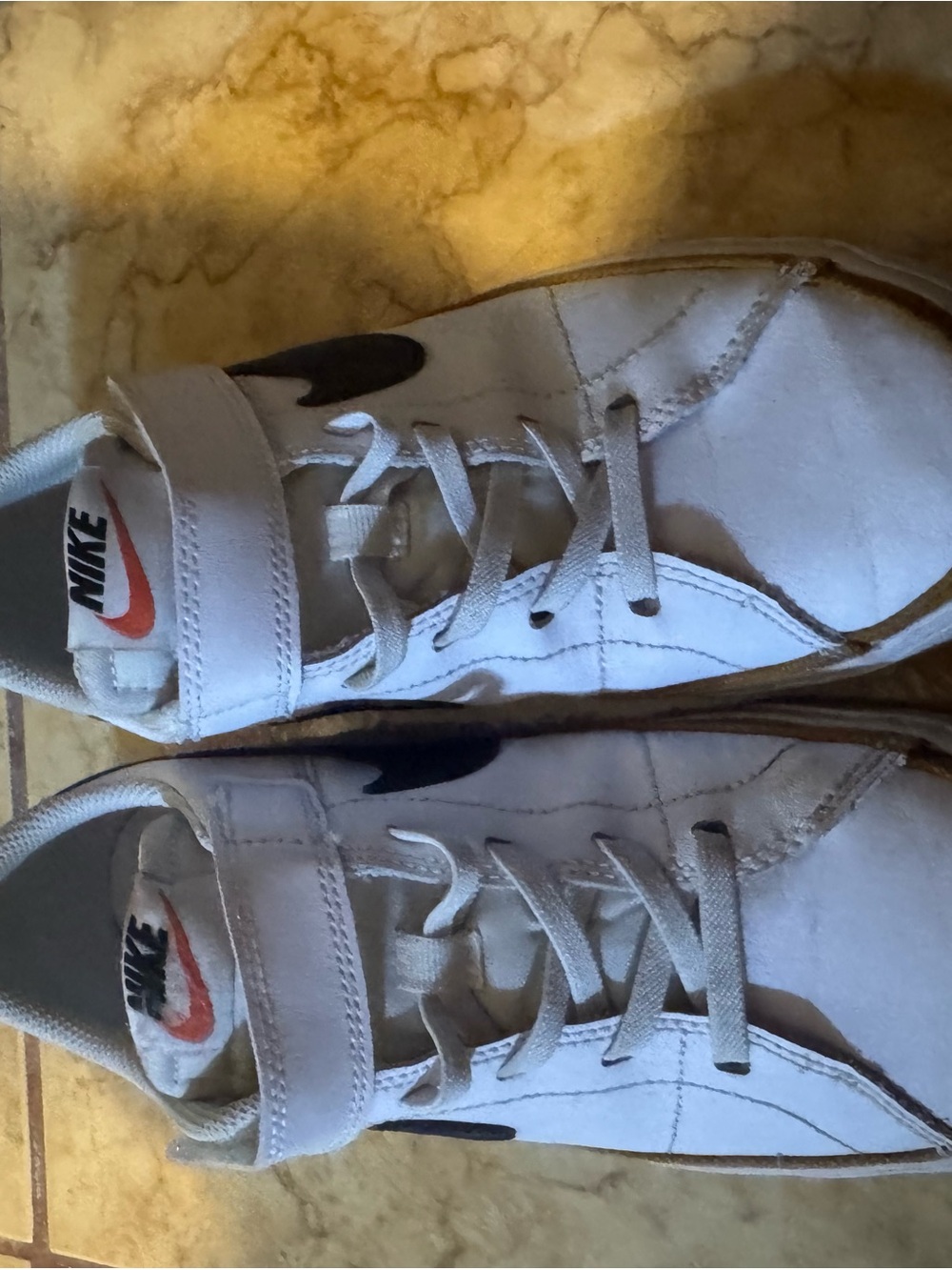 Nike Kids White Sneakers with Black Swoosh and Red Logo